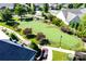 Community putting green with a pergola and landscaping at 12821 Mayes Rd, Huntersville, NC 28078