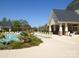 Community pool with lounge chairs and clubhouse in background at 12821 Mayes Rd, Huntersville, NC 28078