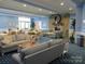 Community lounge with comfortable seating and a stone fireplace at 12821 Mayes Rd, Huntersville, NC 28078
