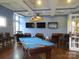 Game room with pool table and comfortable seating at 12821 Mayes Rd, Huntersville, NC 28078
