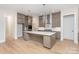 Modern kitchen with gray cabinets, quartz countertops, and island at 1336 Sage Pine Cir # 21, Clover, SC 29710