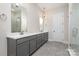 Double vanity bathroom with gray cabinets, quartz countertops, and a large shower at 1336 Sage Pine Cir # 21, Clover, SC 29710