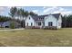 Two-story farmhouse with brick and white siding, a front porch, and a well-manicured lawn at 1336 Sage Pine Cir # 21, Clover, SC 29710