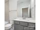 Well-lit bathroom with gray vanity, toilet, and a shower/tub combination at 1336 Sage Pine Cir # 21, Clover, SC 29710