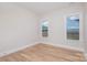Well-lit bedroom with hardwood floors and two windows offering natural light at 1336 Sage Pine Cir # 21, Clover, SC 29710