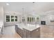Open concept kitchen with large island, stainless steel appliances, and hardwood floors at 1336 Sage Pine Cir # 21, Clover, SC 29710