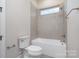 Clean bathroom with a bathtub, toilet and a window for natural light at 1336 Sage Pine Cir # 21, Clover, SC 29710