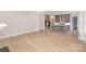 Open concept living room with hardwood floors and kitchen view at 1336 Sage Pine Cir # 21, Clover, SC 29710
