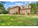 Two-story brick home exterior with a landscaped lawn at 8321 Knights Ct, Harrisburg, NC 28075