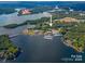 Aerial view of lakefront land with marina and resort in the distance at 4516 Slanting Bridge Rd, Sherrills Ford, NC 28673
