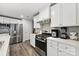 Modern kitchen with stainless steel appliances and white cabinets at 1332 Lena St, Monroe, NC 28112