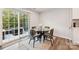 Breakfast nook with glass-top table, four chairs, and sliding door to patio at 1332 Lena St, Monroe, NC 28112