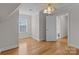 Well-lit bedroom with hardwood floors and an ensuite bathroom at 4532 Lanstone Sw Ct, Concord, NC 28027