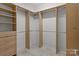 Large walk-in closet offers ample storage space with shelving and rods at 4532 Lanstone Sw Ct, Concord, NC 28027