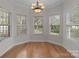 Breakfast nook with hardwood floors and multiple windows at 4532 Lanstone Sw Ct, Concord, NC 28027