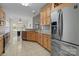 Kitchen with stainless steel appliances and light wood cabinets at 4532 Lanstone Sw Ct, Concord, NC 28027