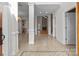 Bright and spacious entryway with tile floors and views to the living room and kitchen at 4532 Lanstone Sw Ct, Concord, NC 28027