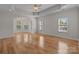 Spacious living room with hardwood floors and a bay window at 4532 Lanstone Sw Ct, Concord, NC 28027