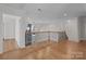 Bright upper hallway with hardwood floors and access to bedrooms at 4532 Lanstone Sw Ct, Concord, NC 28027