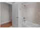 Simple bathroom with shower and tile surround at 4532 Lanstone Sw Ct, Concord, NC 28027