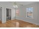 Hardwood floor bedroom with ensuite bathroom and window at 4532 Lanstone Sw Ct, Concord, NC 28027