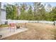 Cozy patio with fire pit and seating area at 12009 Downy Birch Rd, Charlotte, NC 28227