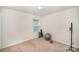 Spacious bedroom with window, carpet, and room for fitness at 12009 Downy Birch Rd, Charlotte, NC 28227