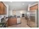 Bright kitchen features granite counters, stainless steel appliances, and hardwood floors at 12009 Downy Birch Rd, Charlotte, NC 28227