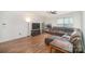 Open living area with hardwood floors and a large brown sectional sofa at 12009 Downy Birch Rd, Charlotte, NC 28227