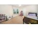 Bright bedroom with window, carpet, and room for a bed at 12009 Downy Birch Rd, Charlotte, NC 28227