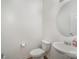 Clean and simple half bathroom with pedestal sink and round mirror at 12009 Downy Birch Rd, Charlotte, NC 28227