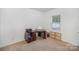 Versatile bedroom space with carpeted floor and large window at 12009 Downy Birch Rd, Charlotte, NC 28227
