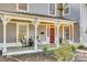 Charming front porch with rocking chairs and decorative pillars at 203 Kings Mountain St, Clover, SC 29710