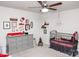 Bedroom with crib, changing table, and baseball theme decor at 145 Beacon Dr # F, Mooresville, NC 28117