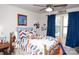 Bright bedroom with a full-size bed and blue accents at 145 Beacon Dr # F, Mooresville, NC 28117