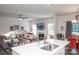 Modern kitchen with white cabinets, stainless steel appliances and an island at 145 Beacon Dr # F, Mooresville, NC 28117