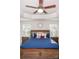 Spacious main bedroom with a large bed, nightstands and ceiling fan at 145 Beacon Dr # F, Mooresville, NC 28117