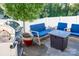 Relaxing patio with seating, fire pit, and grill at 145 Beacon Dr # F, Mooresville, NC 28117