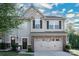 Two-story townhome with gray siding and stone accents at 145 Beacon Dr # F, Mooresville, NC 28117