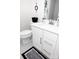 Stylish bathroom with white vanity and black and white rug at 145 Beacon Dr # F, Mooresville, NC 28117