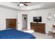 Spacious bedroom with dresser, TV, and large bed at 145 Beacon Dr # F, Mooresville, NC 28117