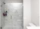 Large walk-in shower with marble tile and glass enclosure at 145 Beacon Dr # F, Mooresville, NC 28117