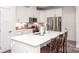 White kitchen with stainless steel appliances and island at 145 Beacon Dr # F, Mooresville, NC 28117