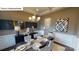 Formal dining room with chandelier and wainscoting at 6030 Sylvan Dr, Denver, NC 28037