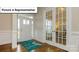 Bright entryway with hardwood floors and French doors at 6024 Sylvan Dr, Denver, NC 28037