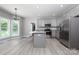 Modern kitchen with gray cabinets, stainless steel appliances, and island at 126 Jason Ln, Mooresville, NC 28115