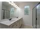 Elegant bathroom with dual sinks, large mirror, and a walk-in shower at 1957 Tablerock Dr, York, SC 29745