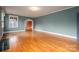 Living room with hardwood floors and fireplace at 424 S College Ave, Newton, NC 28658