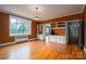 Bright dining room featuring built-in shelving and hardwood floors at 424 S College Ave, Newton, NC 28658