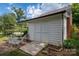 White shed with patio furniture and brick paving at 424 S College Ave, Newton, NC 28658